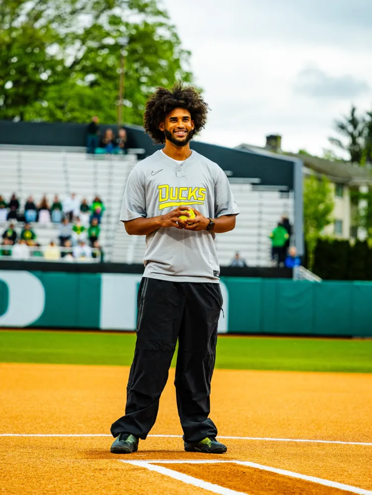 Dante Moore throwing the first pitch at an Oregon Ducks game