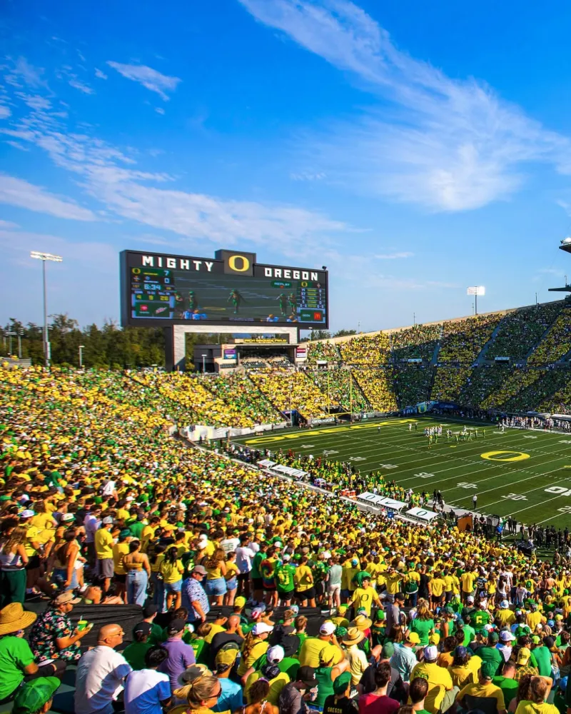 Packed Autzen Stadium crowd in green and yellow