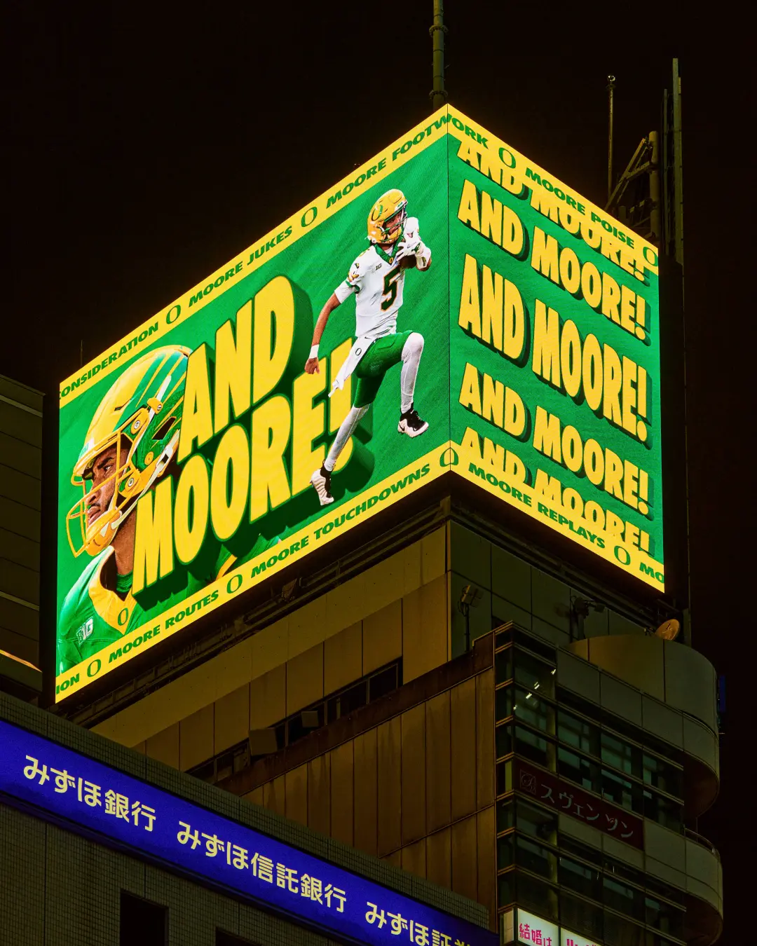 Dante Moore ‘Yes, There’s Moore’ billboard — And Moore, Tokyo